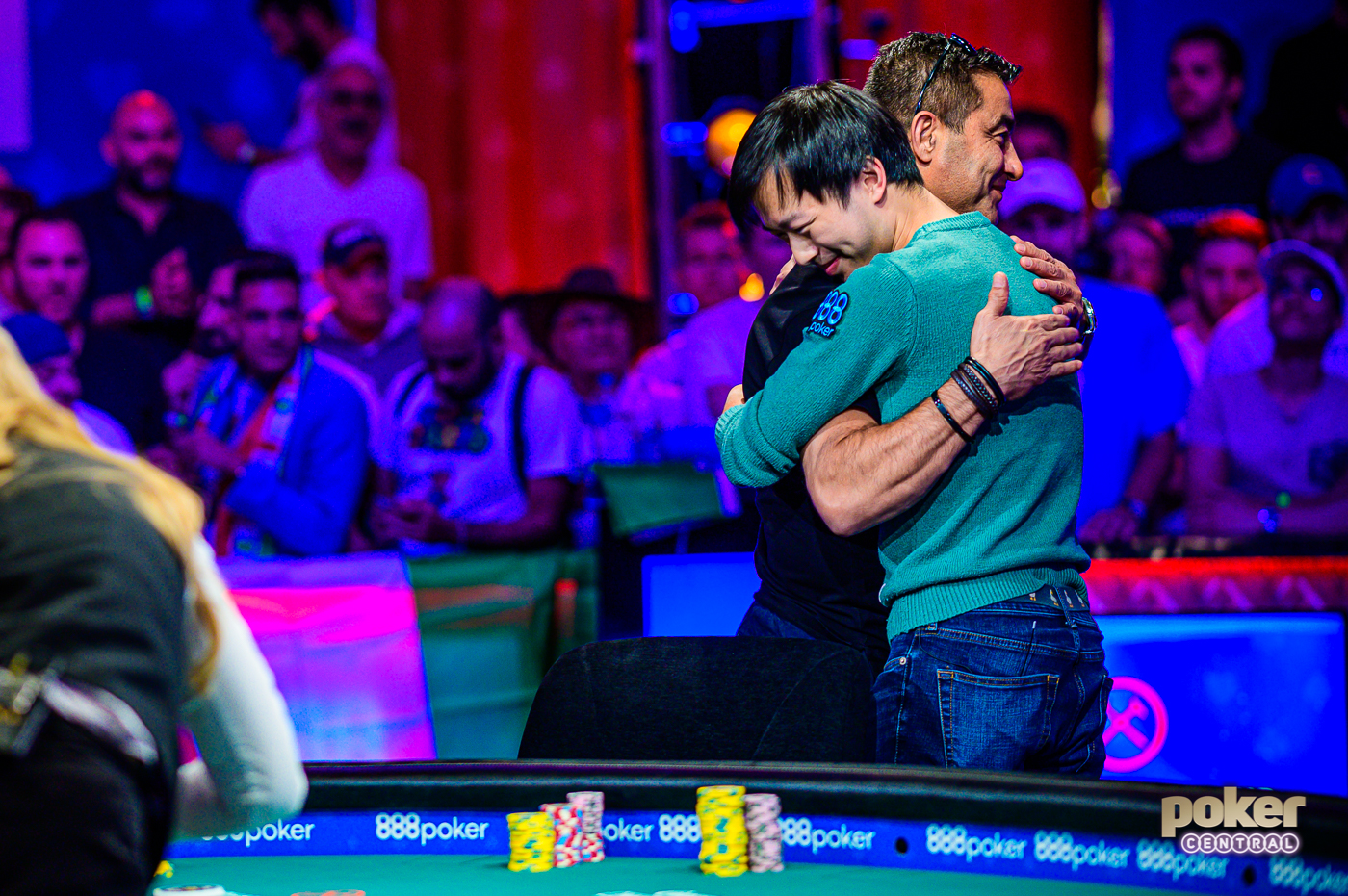 Timothy Su hugs Hossein Ensan after getting eliminated in 8th place for $1,250,000.