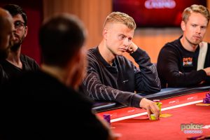 Jens Kyllonen flanked by Joni Jouhkimainen at the final table of the £10,000 Pot Limit Omaha event at the British Poker Open.